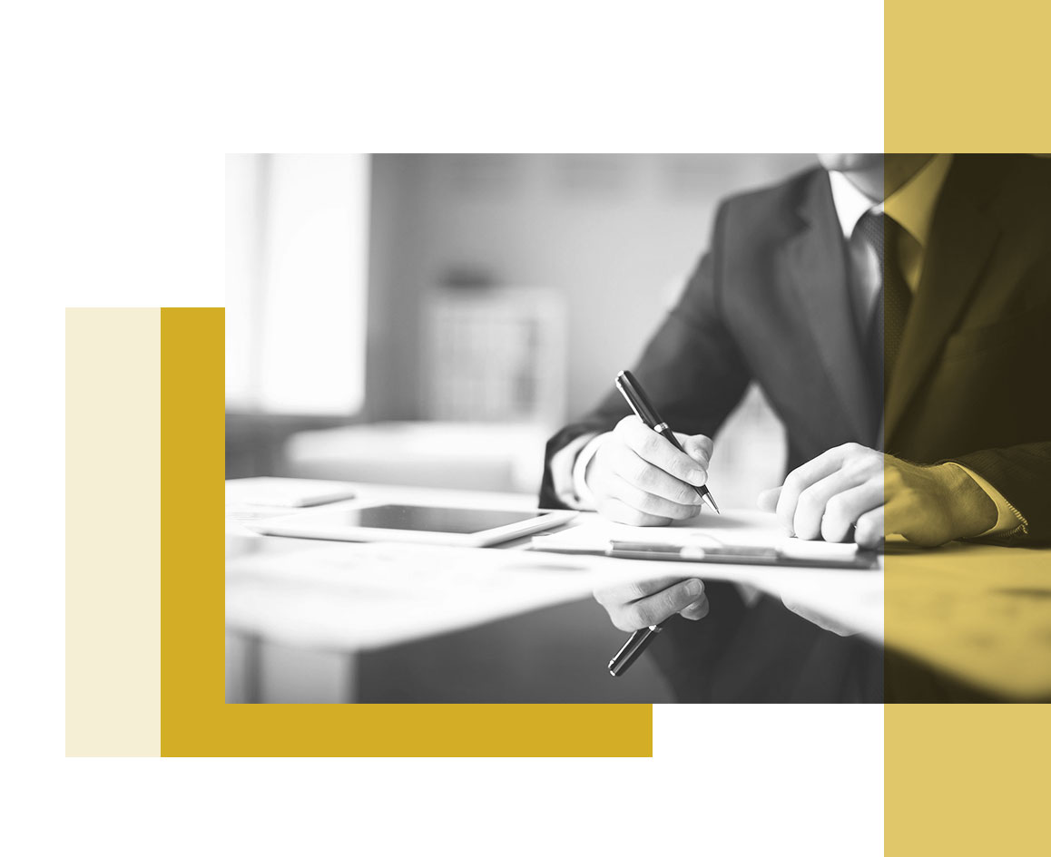 A new team member signing an employment contract at Baker Ing