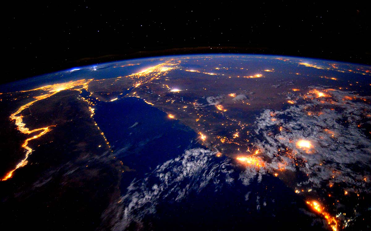 Earth displaying illuminated cities and territories